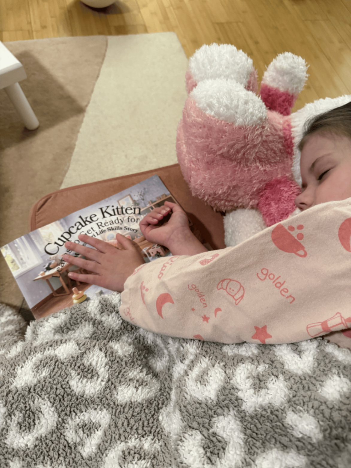 Child resting with Cupcake Kitten Learns to Get Ready for Bed